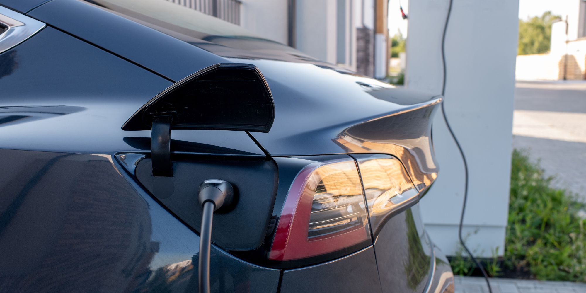 Home with electric vehicle charging nearby