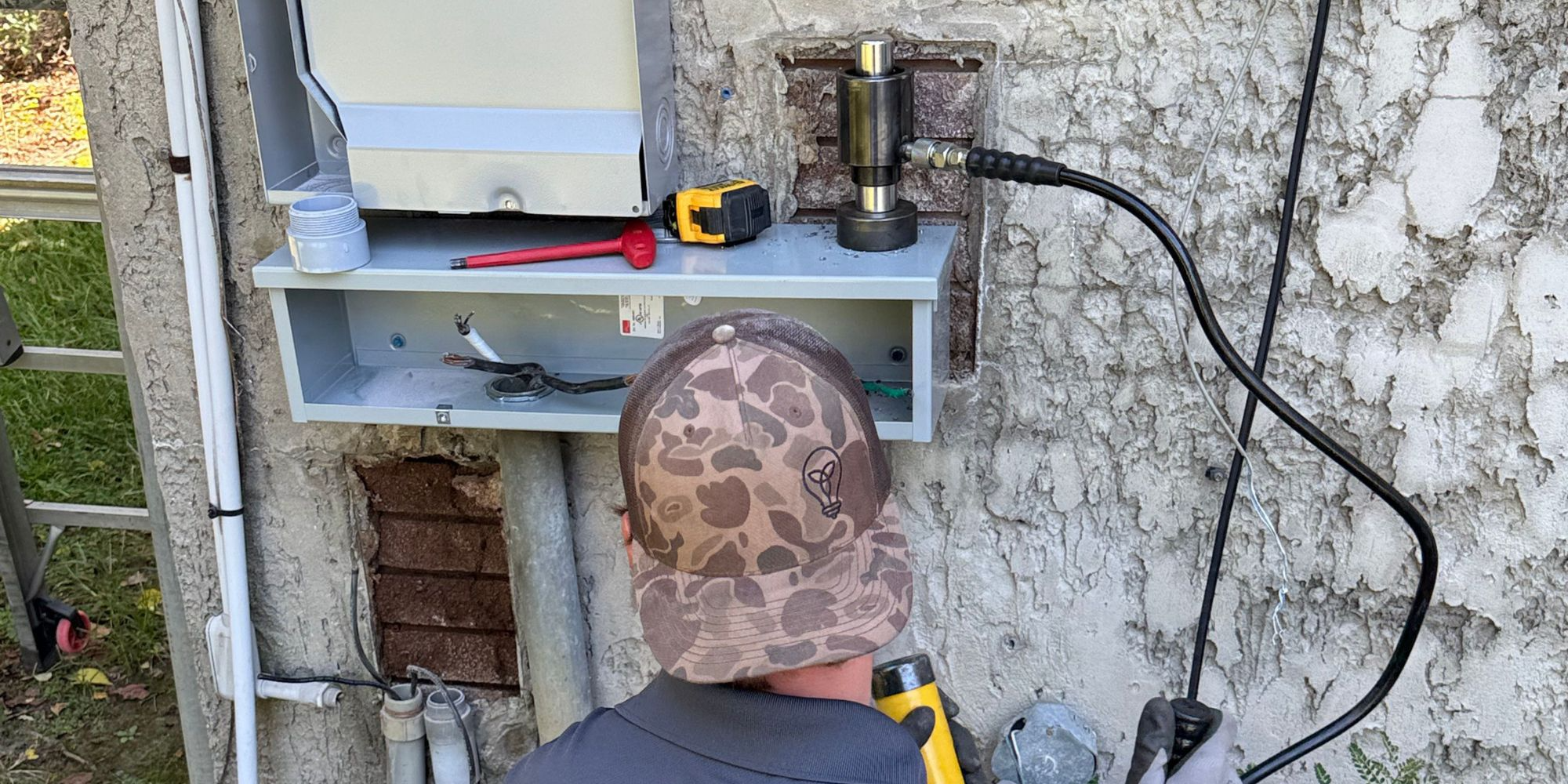 Trinitas All Electric professionals working on electrical installation